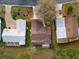 Aerial view of three homes in a community at 819 Bolivar St, The Villages, FL 32159