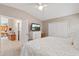 Main bedroom with king bed and view of kitchen at 819 Bolivar St, The Villages, FL 32159