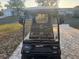 Front view of black golf cart with accessories at 819 Bolivar St, The Villages, FL 32159