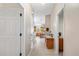 Bright hallway with tile floor and view into kitchen area at 819 Bolivar St, The Villages, FL 32159