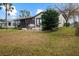 View of house exterior showcasing a patio area at 819 Bolivar St, The Villages, FL 32159