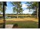 Enjoy peaceful lake views from this patio at 819 Bolivar St, The Villages, FL 32159