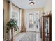 Bright foyer features tile flooring, a decorative glass door, and ample natural light at 8662 Se 133Rd Ln, Summerfield, FL 34491