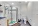 Bright and clean bathroom with a glass-enclosed shower at 9210 County Road 48, Yalaha, FL 34797