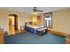Bedroom featuring ceiling fan, dark hardwood floors and an area rug at 9210 County Road 48, Yalaha, FL 34797