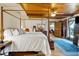 Spacious bedroom with wooden ceiling and four post bed at 9210 County Road 48, Yalaha, FL 34797