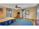 Bedroom featuring a ceiling fan, natural light, and a dresser with television at 9210 County Road 48, Yalaha, FL 34797