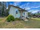 Charming one-story home with a well-maintained lawn at 9210 County Road 48, Yalaha, FL 34797