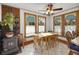 Charming kitchen nook with wood table and antique stove at 9210 County Road 48, Yalaha, FL 34797