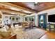 Comfortable living room featuring a pool table and plush seating at 9210 County Road 48, Yalaha, FL 34797