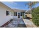 Exterior view of the home's backyard with a patio and a view of the surrounding landscape at 9951 Se 175Th St, Summerfield, FL 34491