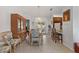 Bright dining area featuring a chandelier, tiled floors, and furniture at 9951 Se 175Th St, Summerfield, FL 34491