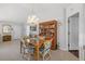 Bright dining area featuring a chandelier, tiled floors, and rattan furniture, showcasing a inviting space for entertaining guests at 9951 Se 175Th St, Summerfield, FL 34491