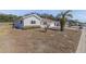 View of a single-story home featuring a well-kept lawn and tidy landscaping, highlighting its curb appeal and neighborhood at 9951 Se 175Th St, Summerfield, FL 34491