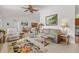 Inviting living room showcasing neutral colors, comfortable seating, and tile flooring, creating a cozy and welcoming atmosphere at 9951 Se 175Th St, Summerfield, FL 34491