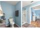 Bathroom featuring a toilet, sink and a stand-up shower at 10347 Se 179Th St, Summerfield, FL 34491