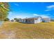 Spacious backyard featuring a covered patio, ideal for outdoor gatherings at 10347 Se 179Th St, Summerfield, FL 34491