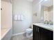 Clean bathroom with a tub, toilet, and vanity with neutral decor at 113 Bayou Bend Rd, Groveland, FL 34736