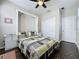 Comfortable bedroom featuring a stylish bed, ceiling fan, closet and built in dressers with a peaceful and inviting atmosphere at 113 Bayou Bend Rd, Groveland, FL 34736