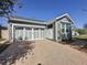 Charming single-Gathering home featuring a two-car garage and a brick driveway at 113 Bayou Bend Rd, Groveland, FL 34736