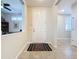 Bright foyer with tile flooring leading to other rooms in the home at 113 Bayou Bend Rd, Groveland, FL 34736