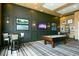 Game room featuring a pool table, wall decor, and comfortable seating at 113 Bayou Bend Rd, Groveland, FL 34736