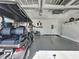 View of the garage with ample storage space for recreational vehicles, bikes, and other items at 113 Bayou Bend Rd, Groveland, FL 34736