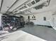 View of the garage featuring a golf cart, bike, and plentiful storage options at 113 Bayou Bend Rd, Groveland, FL 34736