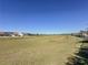 A large open green space is available for recreation or relaxation in the community at 113 Bayou Bend Rd, Groveland, FL 34736