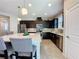Well-equipped kitchen with stainless steel appliances, tiled backsplash, and a spacious island at 113 Bayou Bend Rd, Groveland, FL 34736