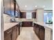 Modern kitchen with stainless steel appliances, tile backsplash, and quartz countertops at 113 Bayou Bend Rd, Groveland, FL 34736