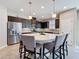 Modern kitchen featuring a large central island, stainless steel appliances, and ample cabinetry at 113 Bayou Bend Rd, Groveland, FL 34736