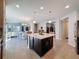 Stylish kitchen featuring central island, stainless appliances, and open layout at 113 Bayou Bend Rd, Groveland, FL 34736