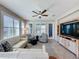 Inviting living room with plantation shutters, neutral tones, and comfortable seating at 113 Bayou Bend Rd, Groveland, FL 34736