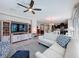 Open-concept living room with seamless flow to kitchen and dining area at 113 Bayou Bend Rd, Groveland, FL 34736