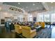 Open-concept lounge area with stylish seating, kitchen and dining area at 113 Bayou Bend Rd, Groveland, FL 34736
