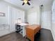 Inviting office with a large desk, built-in shelving, closet, and neutral colors creating an ideal workspace for productivity at 113 Bayou Bend Rd, Groveland, FL 34736