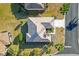 An aerial view shows the property's roof, lawn, driveway, landscaping, and location in a quiet residential neighborhood at 12455 Se 92Nd Ter, Summerfield, FL 34491