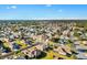 Wonderful aerial view of a house in a quiet neighborhood with manicured lawns and mature trees at 12455 Se 92Nd Ter, Summerfield, FL 34491