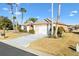 Home featuring palm trees and lush landscaping at 12455 Se 92Nd Ter, Summerfield, FL 34491