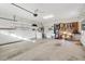 Spacious two car garage with overhead door and storage space at 12455 Se 92Nd Ter, Summerfield, FL 34491