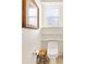 Powder room with wood shelves and a decorative picture frame at 12455 Se 92Nd Ter, Summerfield, FL 34491