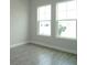 Bedroom featuring two large windows, providing plenty of natural light at 14365 Crest Palm Ave, Windermere, FL 34786