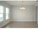 Bright and airy dining room with modern lighting and wood-look tile floors at 14365 Crest Palm Ave, Windermere, FL 34786