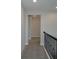 A hallway with carpet is featured in the home at 14365 Crest Palm Ave, Windermere, FL 34786