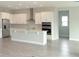 A well-equipped kitchen with stainless steel appliances, a center island, and plenty of counter space at 14365 Crest Palm Ave, Windermere, FL 34786