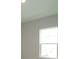 A window bathes a room in natural light, enhancing the living space at 14365 Crest Palm Ave, Windermere, FL 34786