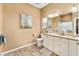 Bathroom with neutral tones, featuring a vanity with granite countertops at 1555 Ward Ct, The Villages, FL 32162