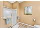 Bathroom featuring a glass-enclosed shower, providing a modern and clean look at 1555 Ward Ct, The Villages, FL 32162