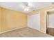Empty bedroom with neutral walls, carpeted floor and large closet at 1555 Ward Ct, The Villages, FL 32162